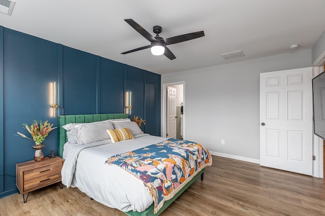 bedroom featuring wood-type flooring and ceiling fan