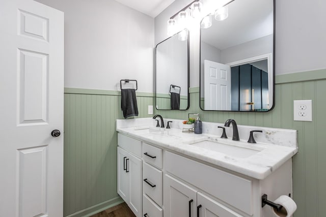 bathroom with hardwood / wood-style floors and vanity