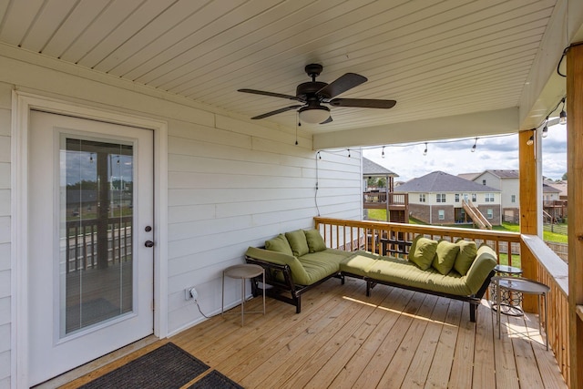 deck featuring a playground, ceiling fan, and an outdoor hangout area