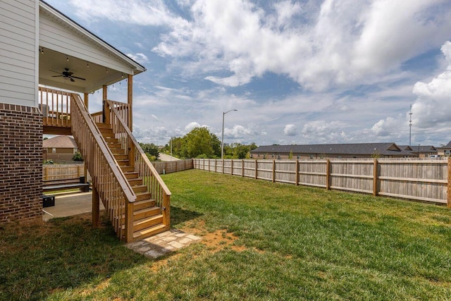 view of yard featuring ceiling fan