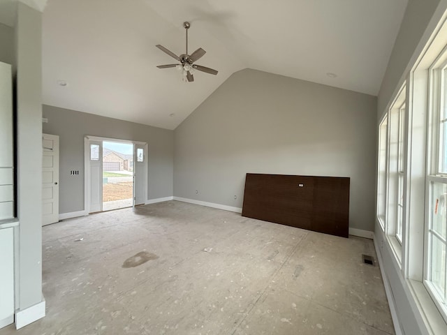 unfurnished living room featuring vaulted ceiling and ceiling fan