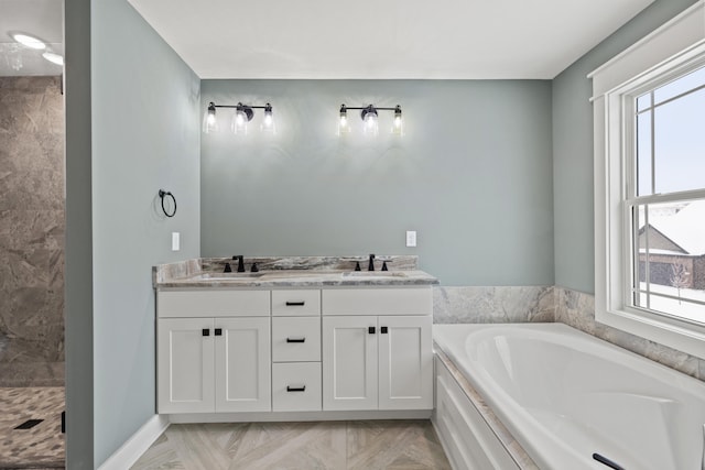 bathroom featuring vanity, parquet flooring, and shower with separate bathtub