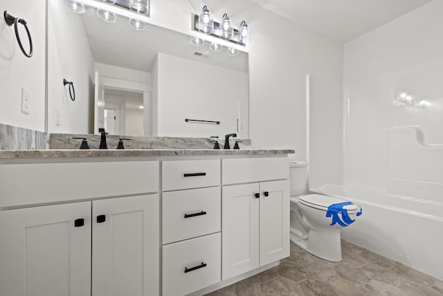 full bathroom with vanity, toilet, and washtub / shower combination