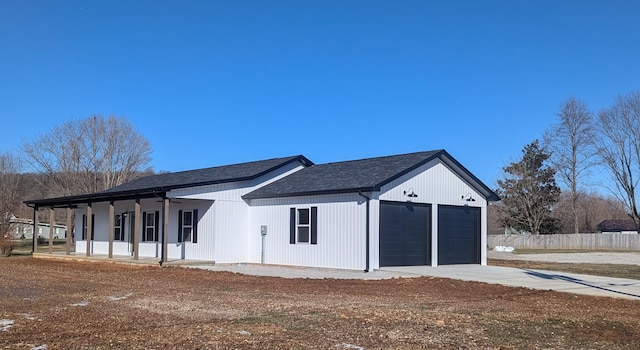 view of front of house featuring a porch and a garage