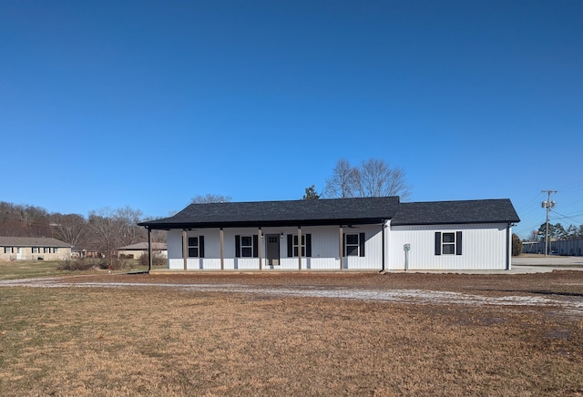 view of front of property with covered porch and a front yard