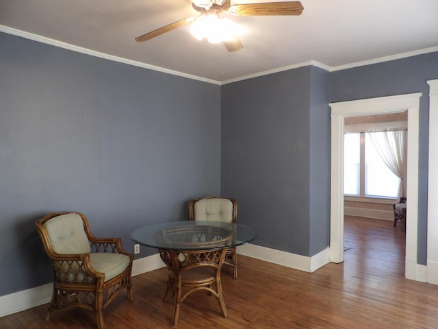 sitting room with crown molding, hardwood / wood-style flooring, and ceiling fan