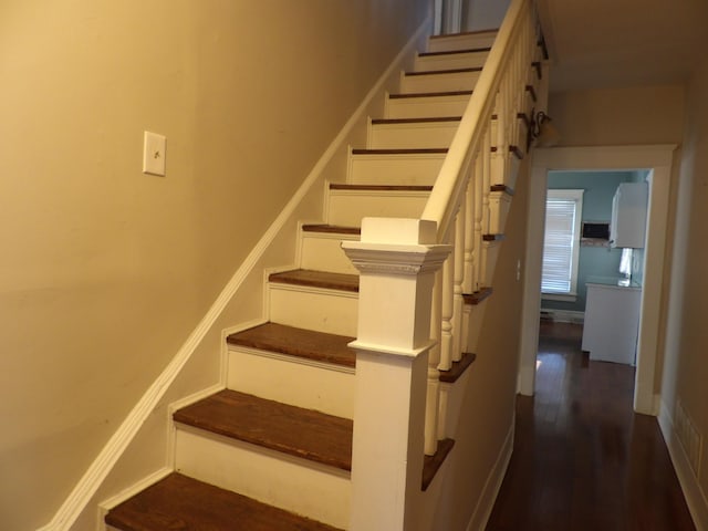 stairway featuring hardwood / wood-style flooring