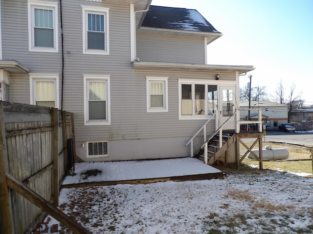 view of snow covered house