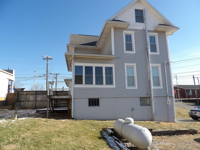 rear view of house with a lawn