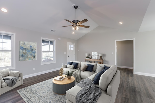 living room with ceiling fan, dark wood-type flooring, and lofted ceiling