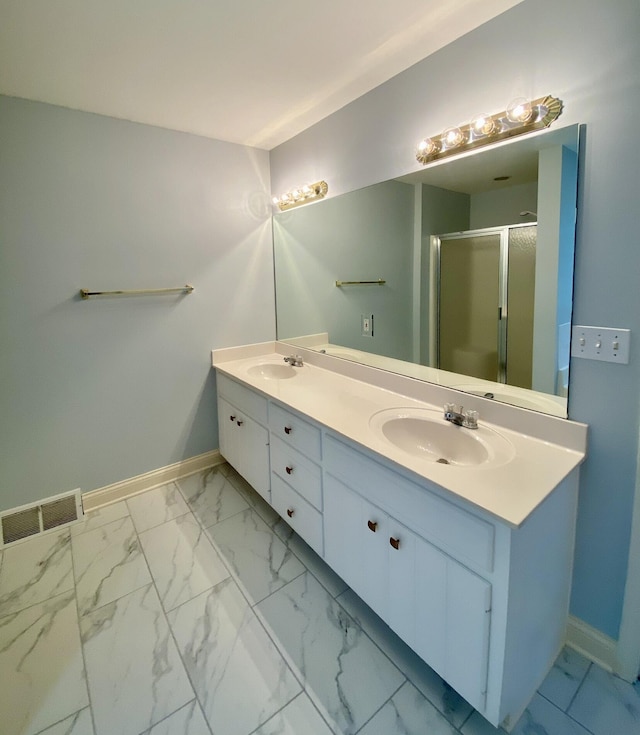 bathroom with vanity and an enclosed shower