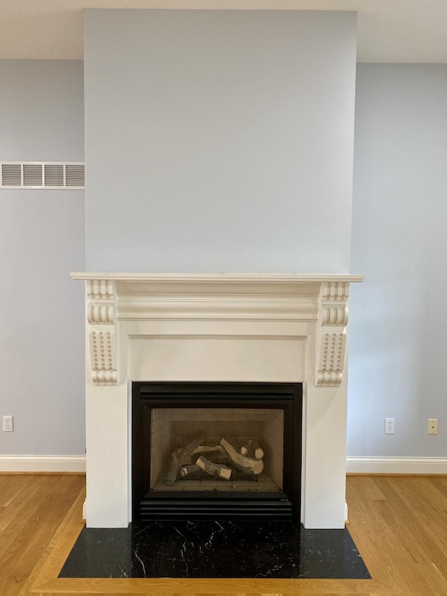 interior details featuring hardwood / wood-style floors