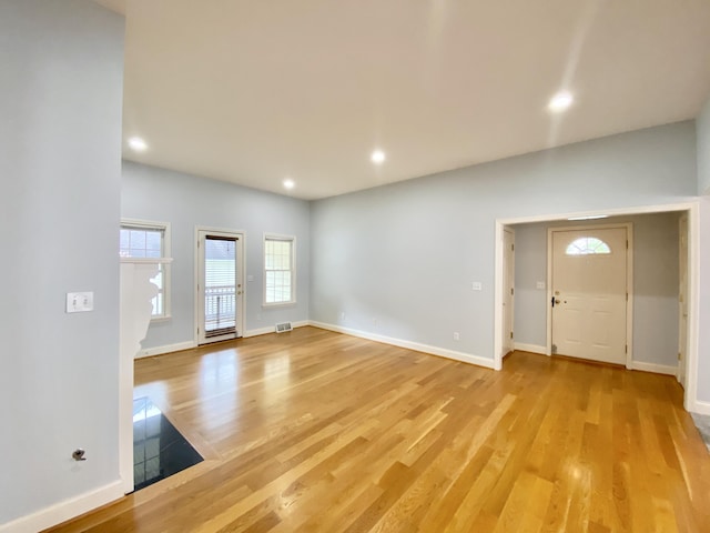 unfurnished living room featuring light wood-type flooring