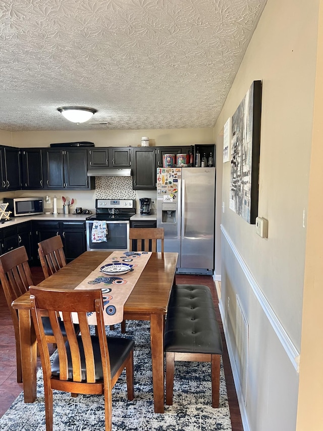 dining room with a textured ceiling