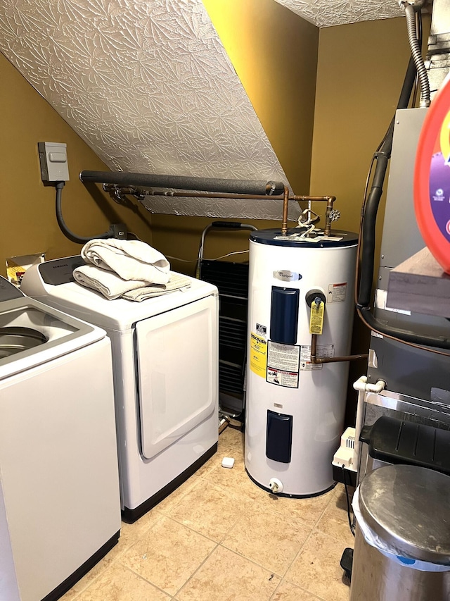 clothes washing area featuring separate washer and dryer, electric water heater, light tile patterned floors, and a textured ceiling