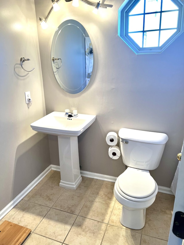 bathroom with tile patterned floors and toilet