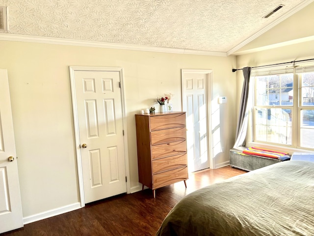 bedroom featuring a textured ceiling, crown molding, dark hardwood / wood-style floors, and lofted ceiling