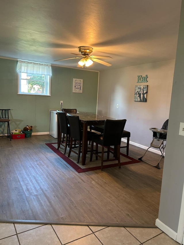 dining room with ceiling fan and tile patterned flooring