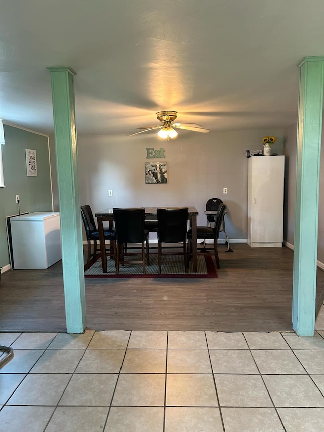 dining space featuring ceiling fan and light tile patterned flooring