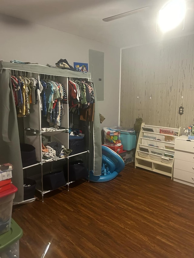 interior space with dark hardwood / wood-style flooring and electric panel