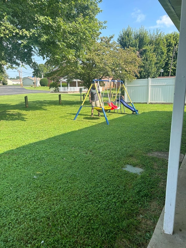 view of play area featuring a lawn