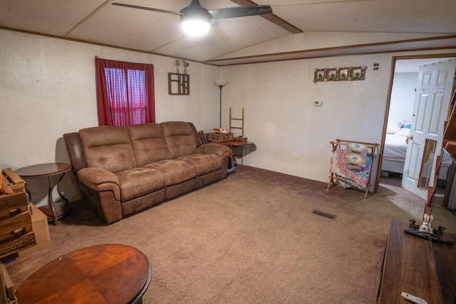 carpeted living room with ceiling fan and lofted ceiling with beams