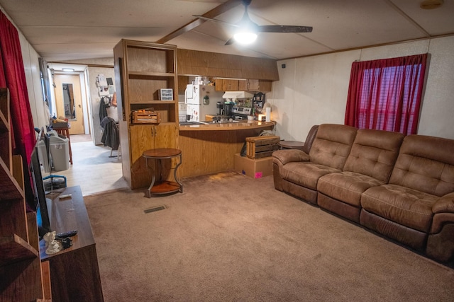 living room with ceiling fan and light colored carpet