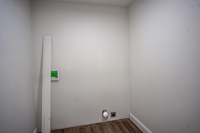 laundry room featuring dark hardwood / wood-style floors and hookup for an electric dryer