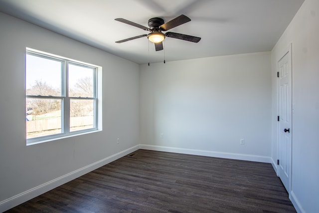 empty room featuring dark hardwood / wood-style floors and ceiling fan