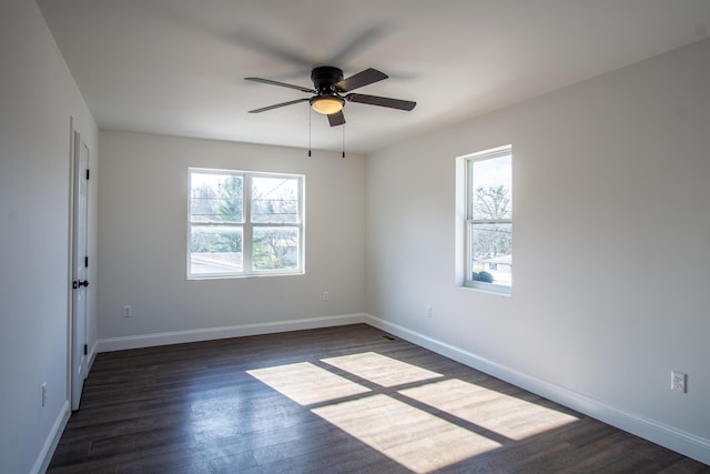 unfurnished room with dark hardwood / wood-style floors and ceiling fan