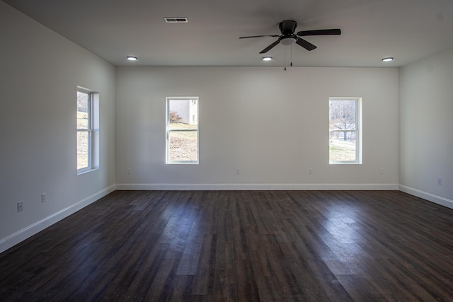 unfurnished room featuring ceiling fan and dark wood-type flooring