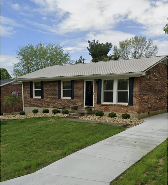 ranch-style home featuring a front yard