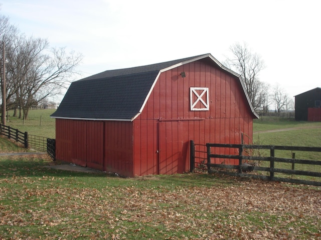 view of outdoor structure featuring a lawn