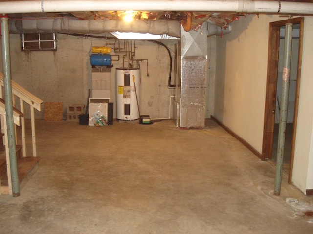 basement featuring heating unit and water heater