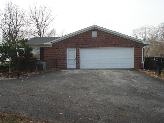 view of side of property with central air condition unit