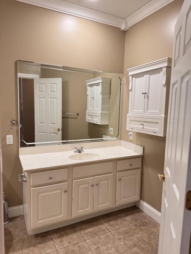 bathroom with tile patterned floors, vanity, and ornamental molding