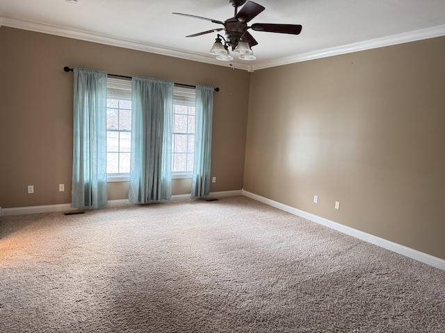 carpeted empty room with crown molding and ceiling fan