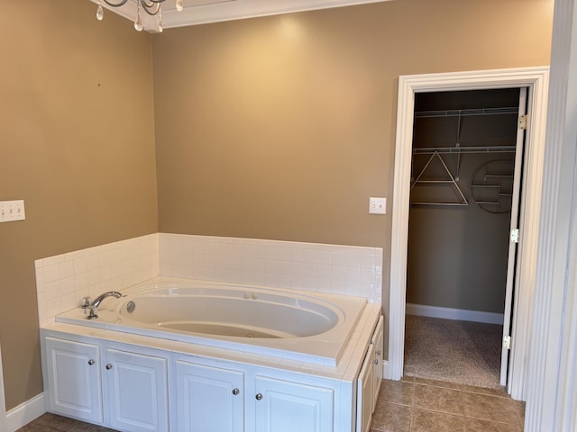 bathroom with tile patterned floors and a tub