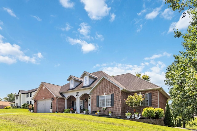 view of front of home with a garage and a front yard