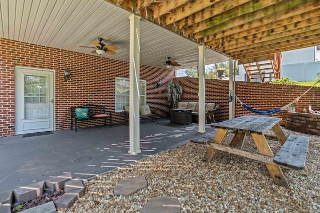 view of patio featuring ceiling fan and an outdoor living space