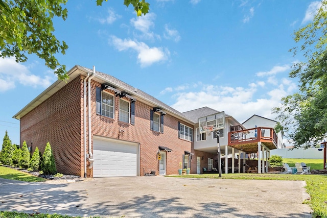 view of front of property with a garage and a wooden deck