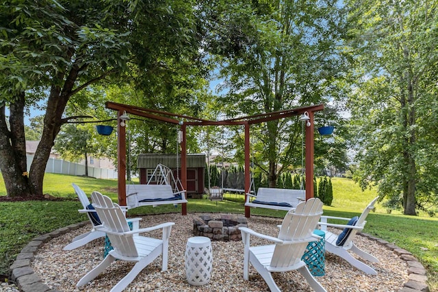 view of patio / terrace with a fire pit and a trampoline