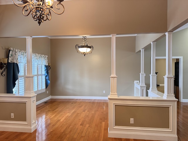 unfurnished dining area with light hardwood / wood-style flooring and an inviting chandelier