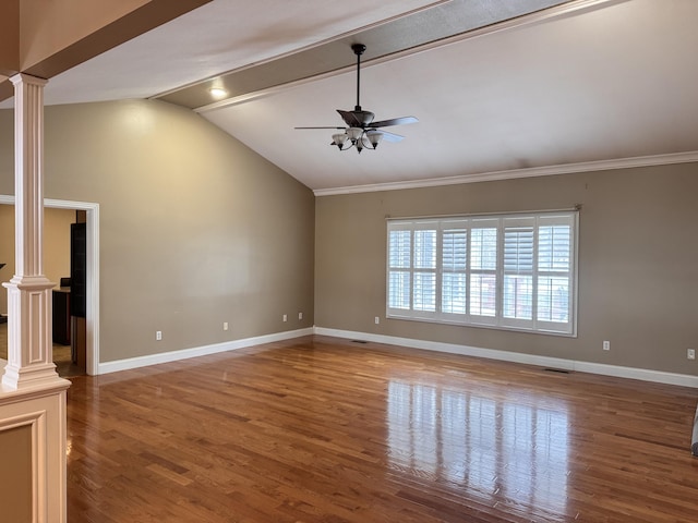 unfurnished living room featuring hardwood / wood-style floors, lofted ceiling, ceiling fan, ornate columns, and ornamental molding