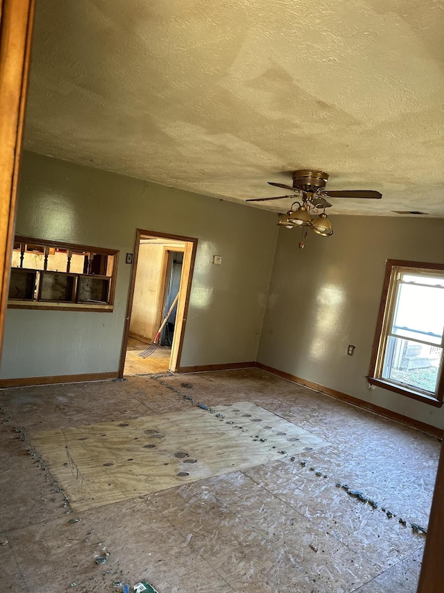 spare room featuring ceiling fan and a textured ceiling