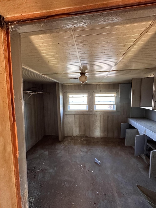 interior space featuring wooden walls