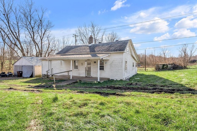 view of front of home featuring covered porch and a front yard