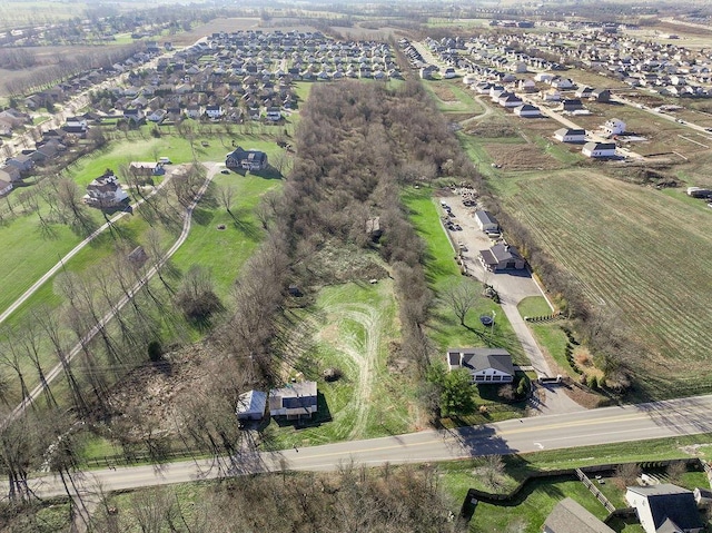 birds eye view of property with a rural view