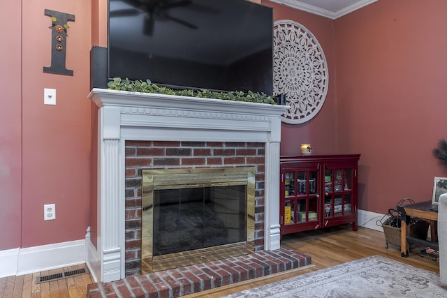 details with wood-type flooring, ornamental molding, and a fireplace