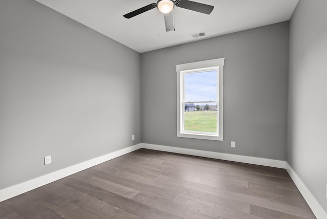 empty room featuring wood-type flooring and ceiling fan